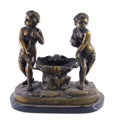 After Carrier Belleuse (French, 1824-1887) A bronzed metal sculpture of two figures beside a clam shell, on a shaped marble base, 31cm wide.