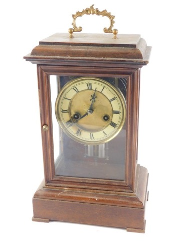 A 19thC continental mantel clock, the paper dial with Roman numerals, in a beech case, 35cm high.