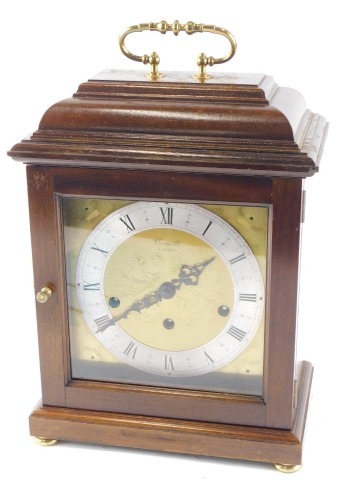 A Comitti mantel clock, with Westminster chime, and eight day movement, in a mahogany case, 35cm high.