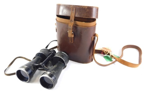 A pair of German WWII binoculars, stamped with the eagle and ARTL, 7x50 BEH35487KF, 22cm high, in associated brown leather case.