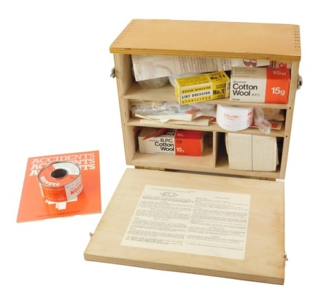 A late 20thC laminated first aid box, with some contents, stamped Office's, Shops and Railway premises at 1963, 28cm wide.