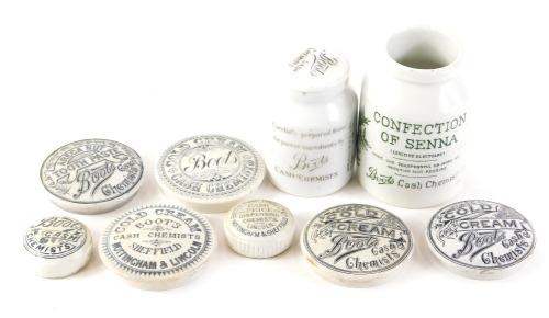 A collection of Boots chemist related pot lids and two jars, to include cold cream, toothpaste, etc., Almond scented shaving cream, etc.