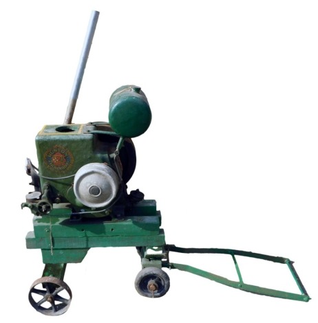 A Ruston Hornsby stationary engine on wooden trolley base, green painted, number 203642, 92cm high, 71cm wide.