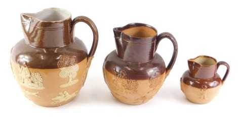 Three Royal Doulton brown stoneware jugs, each decorated in typical form with tavern scenes, hunting, etc., 18cm, 14cm and 8cm high respectively.