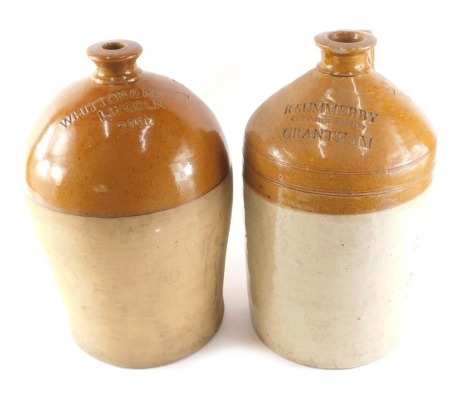 A stoneware flagon stamped R Summersby Grantham, 40cm high (AF), and another stamped Whitton and Ashley Lincoln, 39cm high.