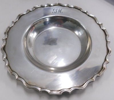 Three items of late 19th/early 20thC silver plated wares, comprising a 19thC silver plated candlestick, 20cm high, a Mappin & Webb salver, with petalated border, bearing the initials GW, 14cm wide, and a Sheffield silver plated serving tray, circa 1880s, - 2