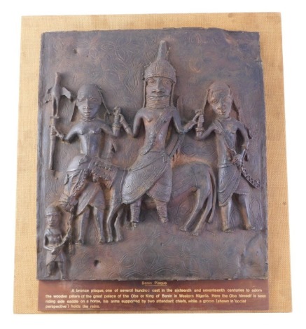 A museum replica model of the Benin plaque, mounted on cork board with informative panel, 49cm high, 46cm wide, in ply travel case.