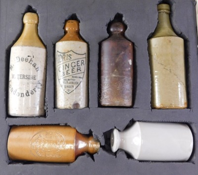 Six Victorian stoneware bottles, to include Idris ginger beer, M.Deehan Londonderry, and The Fortress, etc., the largest bottle 23cm high, in travel case.