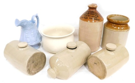 Stoneware, comprising a stoneware bottle for Old Place Road Norwich, 31cm high, thee stoneware hot water bottles, a cream finish chamber pot and a Victorian Staffordshire ware blue jug, 20cm high. (7)