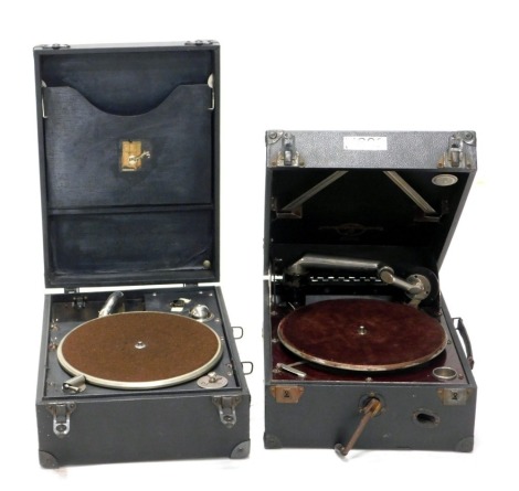 Two cased HMV portable record players.