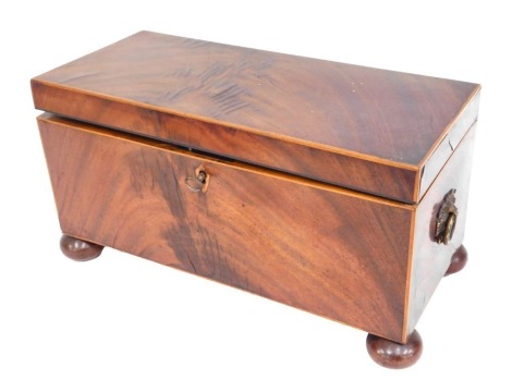 A 19thC mahogany tea caddy, of rectangular form, with a fitted cupboard and bowl interior, with brass swing handles, on bun feet, 18cm high, 33cm wide, 15cm deep.