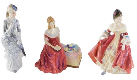 Three Doulton figures, comprising a Royal Doulton Southern Belle, HN2229, 19cm high, a Petite Ladies Fiona, 21cm high, and a Paragon Lady Veronica, 14cm high. (3)