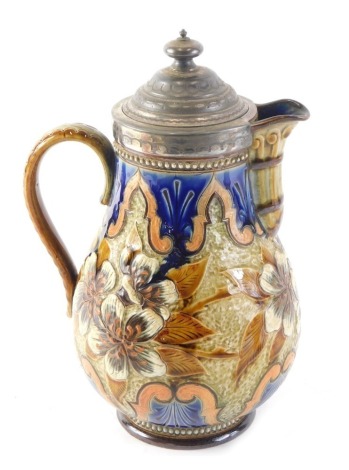 A 19thC Royal Doulton lidded jug, the top mounted with silver plated mounts, on a floral glazed body, on circular foot, 23cm high.