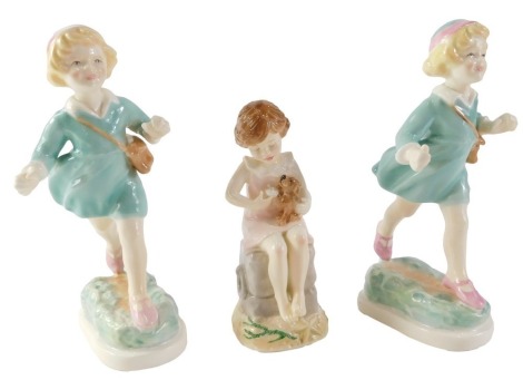 Three Royal Worcester figures, comprising Thursday's Child (x2) and Wednesday's Child, 18cm and 13cm high. (3)