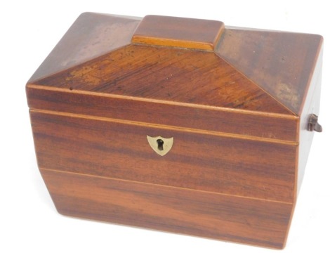 A 19thC mahogany and boxwood strung sarcophagus shaped tea caddy, the hinged lid enclosing two lidded divisions, 19cm wide.