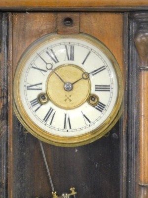 A Vienna wall clock, in walnut case, the dial stamped with cross arrows, 52cm high. - 2