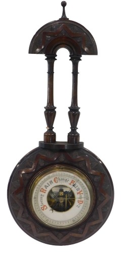 A late 19th/early 20thC carved mahogany aneroid barometer, 48cm high.