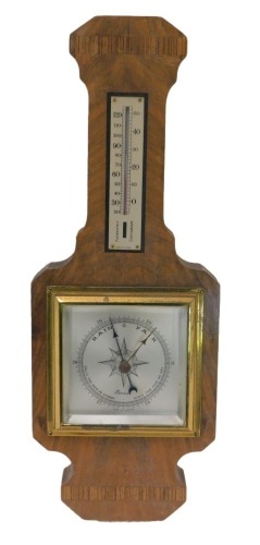 An Art Deco walnut and rosewood aneroid barometer with thermometer, 41cm high.