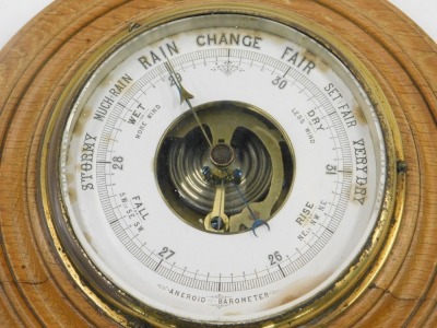 An early 20thC aneroid barometer, in circular moulded oak case, 42cm diameter. - 2