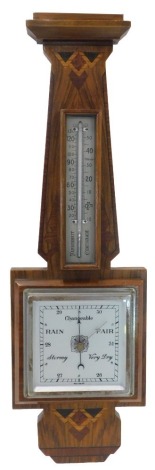 An Art Deco walnut and parquetry aneroid barometer, with thermometer, 58cm high.