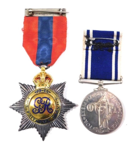 Two police medals, comprising a Faithful Service medal, enamel decorated, on an Elkington bar with red and blue ribbon, 8cm high, and an Exemplary Police Service medal, inscribed Constable Charles E Maughan. (2)