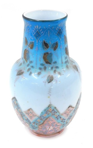 An Eastern cut glass vase, on a blue and pink floral painted ground, 28cm high.