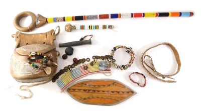 Various African tribal artefacts, to include a staff with beadwork bands, other beaded items to include a wall pocket.