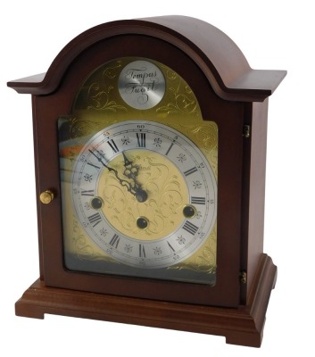 A Hermle mantel clock, with Westminster chime, in a mahogany case, 26cm high.