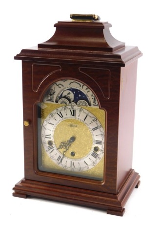 A Hermle mantel clock, with moon phase, Westminster chime, in mahogany case, 35cm high.