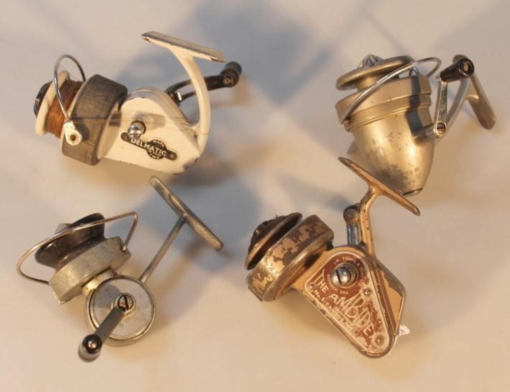 Four vintage fixed spool reels