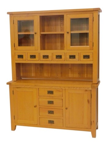 A light oak kitchen dresser, with an arrangement of doors, spice drawers, etc., 200cm high, 150cm wide, 45cm deep.