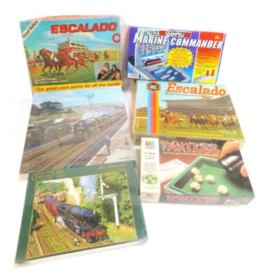 Games and puzzles, including MB Games Yahtzee, Millennium Marine Commander, Chad Valley Escalado, Gibsons Heavy Weight at Seaton puzzle, Falcon Deluxe 500 piece All Aboard puzzle, etc. (a quantity)