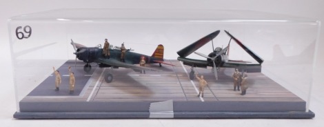 A diorama of a Japanese carrier deck scene, for Pearl Harbour, December 1941, 1:48 scale, featuring two Cape torpedo bombers, in Perspex case.