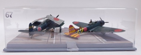 A diorama of Japanese carrier deck scene, for Pearl Harbour Attacks, 1:48 scale, featuring bomber and a Jill, in Perspex case.