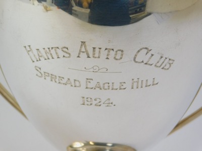 Motor Racing Interest. A George V silver two handled trophy awarded to Raymond Mays, the circular tapering bowl with scroll handles, on a circular stepped base for the Hants Auto Club Spread Eagle Hill 1924, London 1921, 20.21oz, 28cm high. Provenance: Be - 2