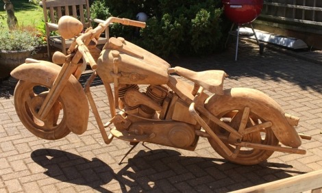 A teak Harley Davidson fat boy motorcycle full scale carving, 115cm high, 93cm wide, 220cm long.