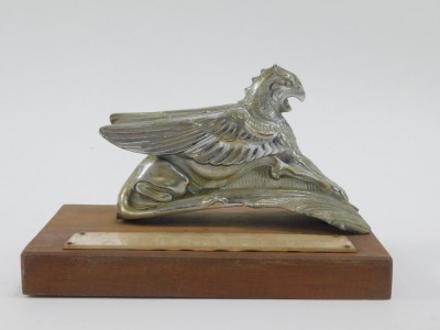 A Terraplane Griffin car mascot, used on both Hudsons and terraplanes, mounted on a rectangular wooden base, 13cm high, 18cm wide, 11cm deep. - 2