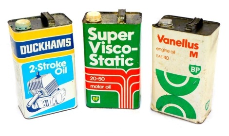 Three vintage oil cans, comprising Duckham's Two Stroke Oil, Vanellus BPM Engine Oil SAE40, BP Super Viscose Static 20-50 Motor Oil, partially filled. (3)