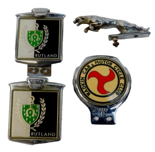 Four car badges, comprising Rutland emblem shield, The Wadkin Car and Motorcycle Club, and a Jaguar mascot. (4)