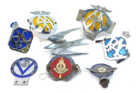 A collection of car badges, comprising two AA car badges, two RAC car badges, a Salvation Army J R Gaunt of London car badge, Vintage Sport Car Club enamel car badge, a Yorkshire Airplane Club badge and a Swift. (8)