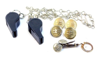 Railwayana, to include rail track buttons, a pair of North East Railway buttons, British Rail Acme Thunderer whistles with chains. (8)