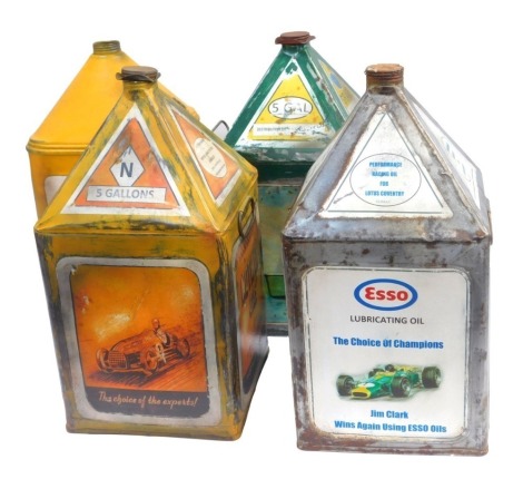 Four five gallon oil cans, including Notwen Oils, Shell Oils, Esso Lubricating Oil The Choice of Champions Jim Clark oil can, and a Gamages Motor Oil oil can. (4)