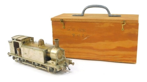 An 'O' gauge electric railway tank locomotive scratch built by George Mackinnon-Ure, LMS Class 3F Jinty, 0-6-0 locomotive, 22cm long, unpainted, with wooden carry case. From the Collection of George Mackinnon-Ure, see lot 130 for biographical details.