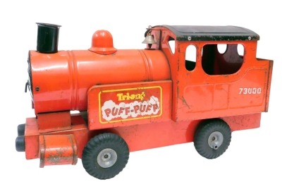 A Tri-ang Puff Puff tinplate train, in red.