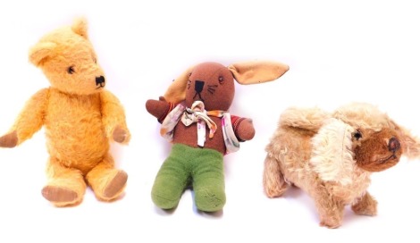 Three early to mid 20thC bears, comprising a plush jointed dog, plush jointed Teddy bear, and a knitted rabbit. (3)