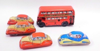 Tinplate models, comprising British made wind up cars, an automatic garage and a London red bus, no keys. - 2