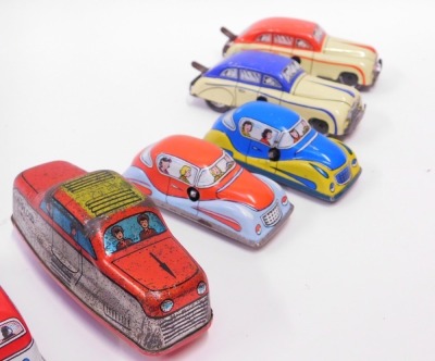 Tinplate models, comprising British made wind up cars, an automatic garage and a London red bus, no keys. - 3