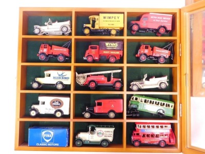 Two yew model car display cabinets, enclosing contents of Models of Yesteryear advertising buses and wagons. (2 cases) - 2