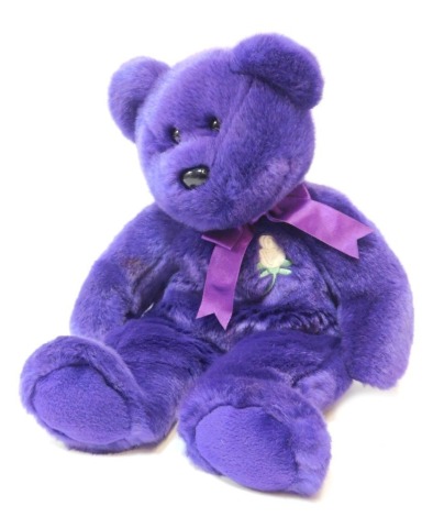 A TY Beanies Princess Diana Commemorative Bear, purple with white rose (1997).