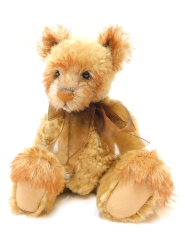 A Charlie Bears plush jointed Teddy bear, with two tone light brown colouring, bearing label, 34cm high.